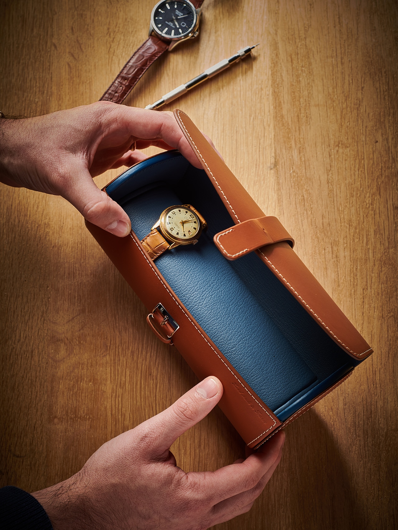 brown blue watch roll rolex wood